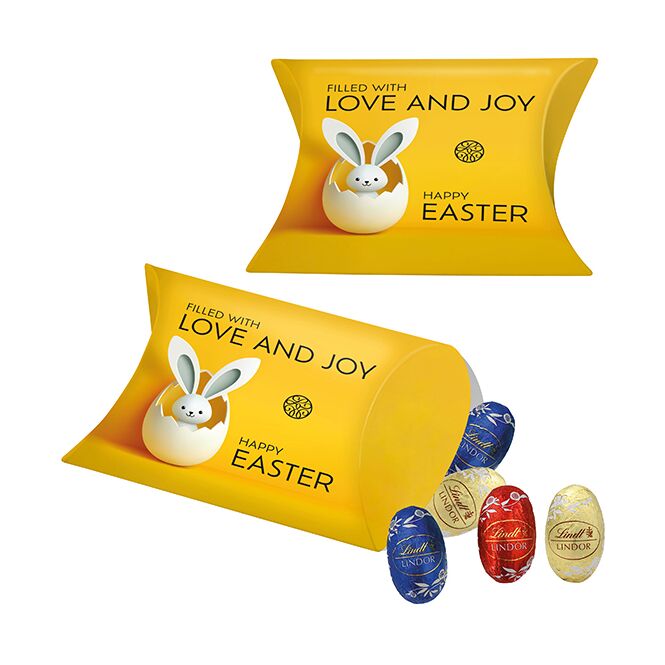 Firmengeschenk Kissenverpackung mit Lindt Mini-Eiern mit Logodruck – Saisonaler Schokoladen-Gruß für Kunden und Geschäftspartner