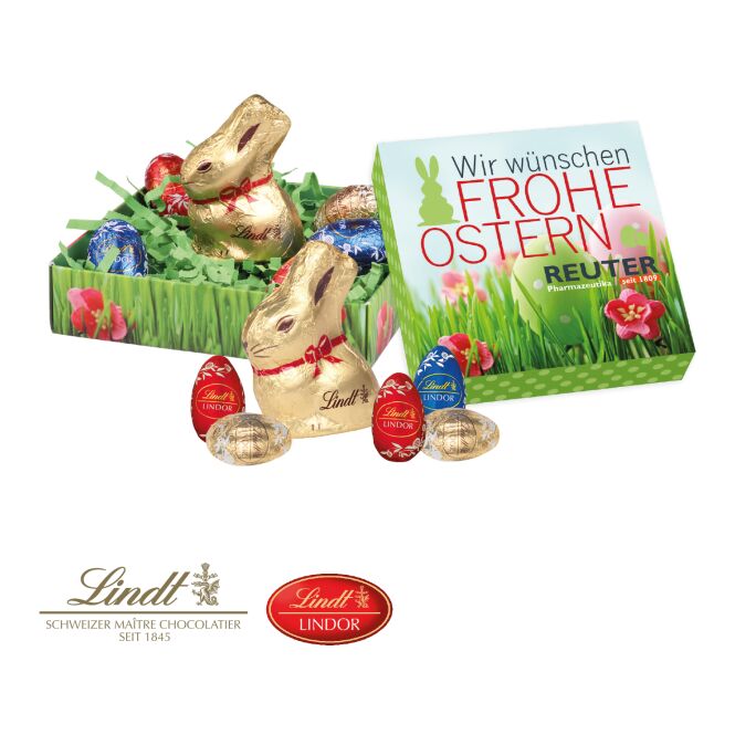Oster-Werbeartikel Lindt Osternest Schokolade – bunt – mit bedrucktem Etikett als süßes Oster-Werbegeschenk für Kunden und Mitarbeiter