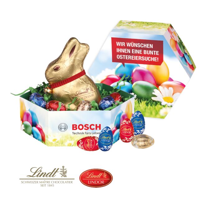Oster-Werbeartikel Lindt Großes Osternest – bunt – mit bedrucktem Etikett als süßes Oster-Werbegeschenk für Kunden und Geschäftspartner