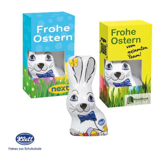 Oster-Werbeartikel Klett Osterhase – bunt – mit individuellem Etikett 40 g als süßes Oster-Werbegeschenk für Kunden und Geschäftspartner